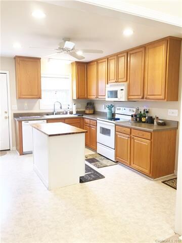 Tall Upper Cabinets, Custom-made Island, Large Foo