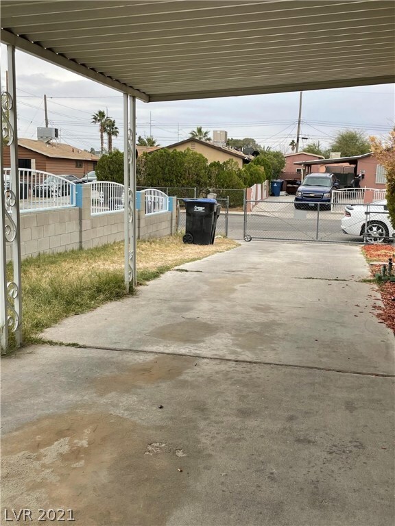 Covered carport/driveway approach to rolling entra