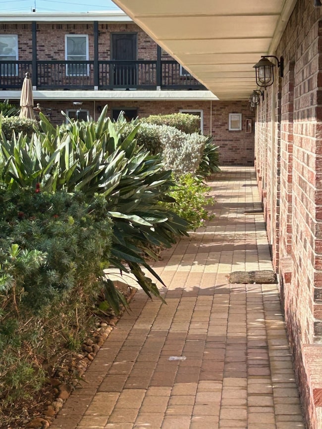 With the condo #109 front door to the immediate right this is the view with the lush landscaping in the courtyard.