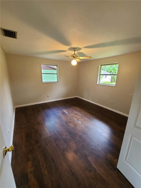 First laminate floored bedroom with a ceiling fan