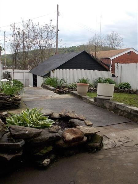 Fenced in back yard with detached garage