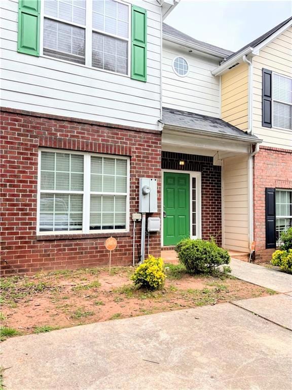 Property entrance with brick siding