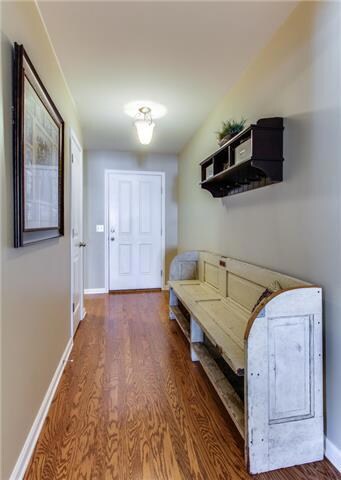 With hardwood floors, this Entryway welcomes your Guests.  The home has both solid & glass front doors.  The Entry boasts coat, linen, & storage closets.