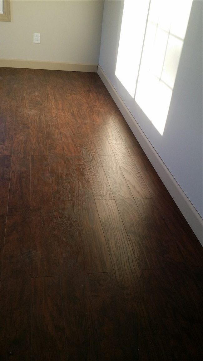 This beautiful wood laminate floor is in the livin