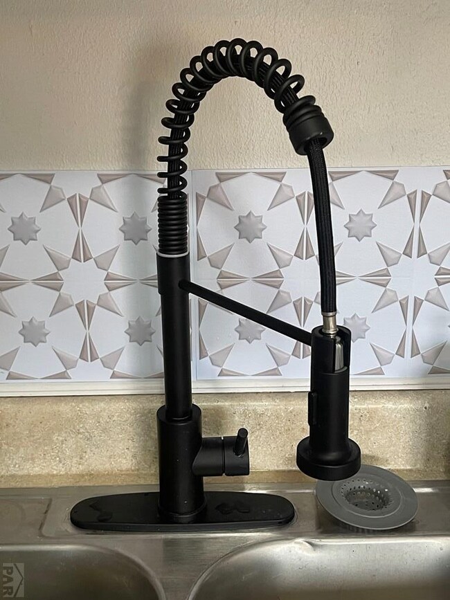 Designer cast iron kitchen faucet