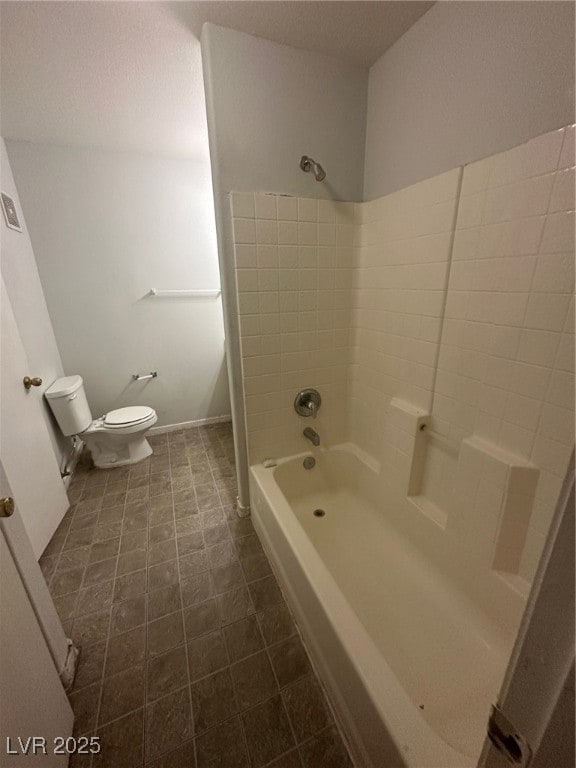 Bathroom featuring toilet and shower / tub combina