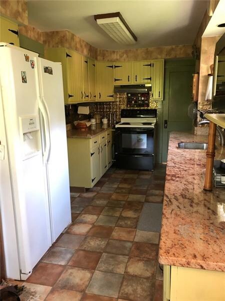Galley kitchen with all the amenities also a cloth