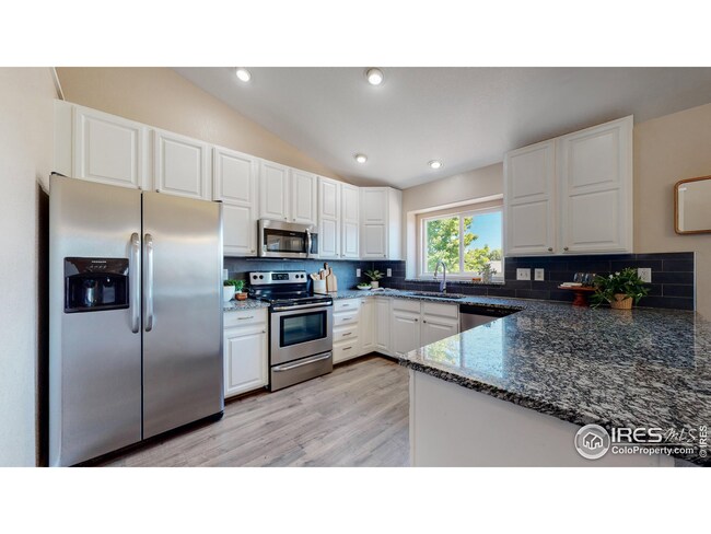 Upgraded kitchen with granite countertops and newer (2017) appliances