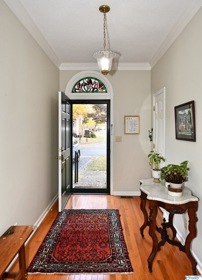 12X6 FOYER WITH HARDWOOD FLOORING.