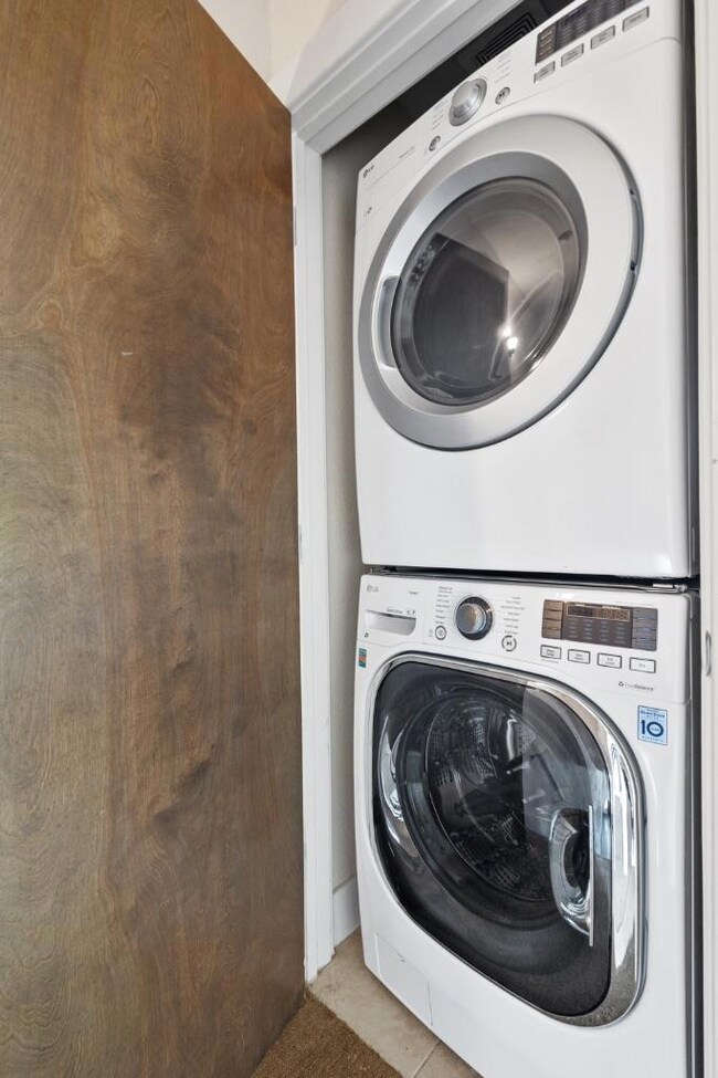Laundry area with stacked washer / drying machine