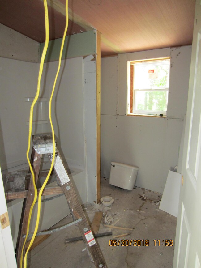 Bathroom with commode