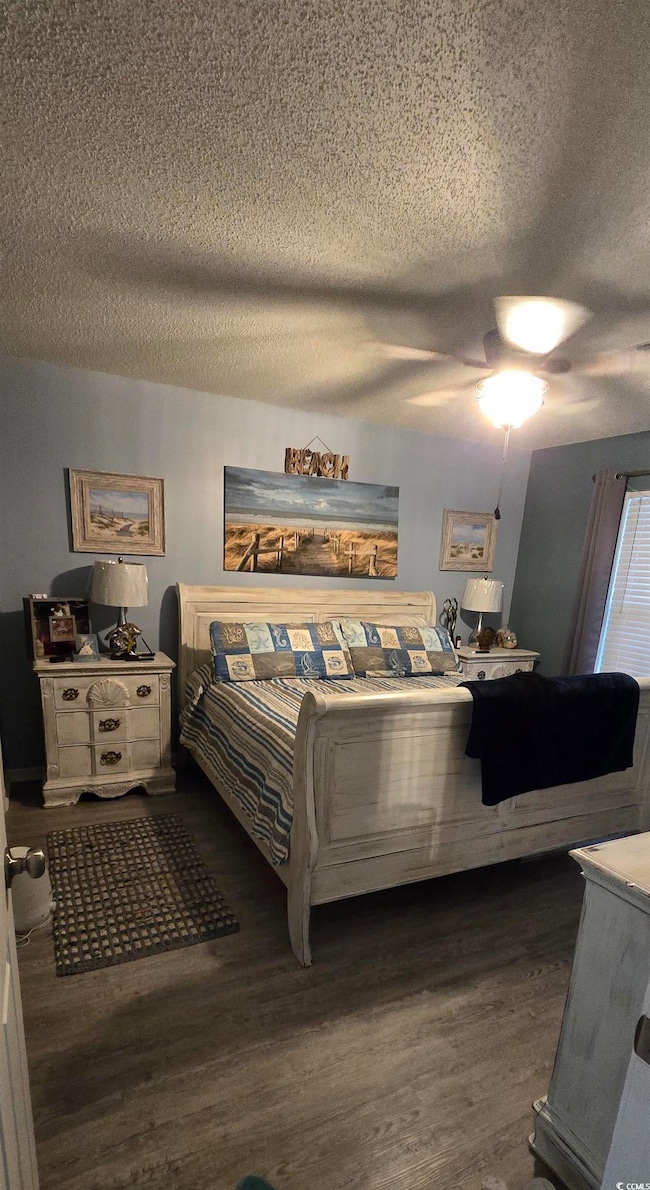 Bedroom featuring dark hardwood / wood-style floor