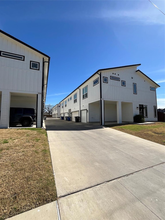 View of property exterior with board and batten si