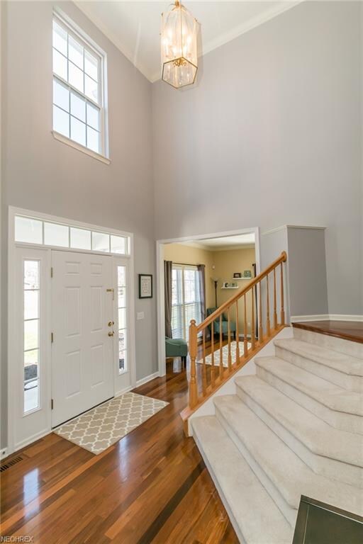 The dramatic two story entry way is painted in tod