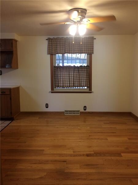 Glossy hardwood floors in the dining area.