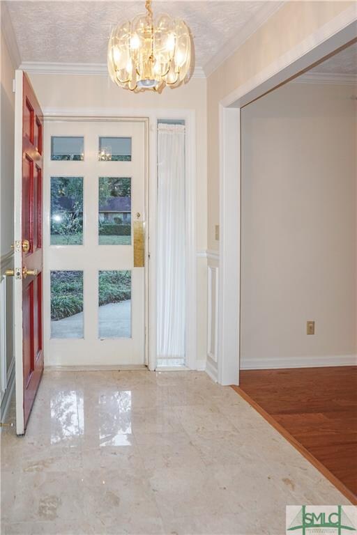 Foyer with Marble entry and storm door