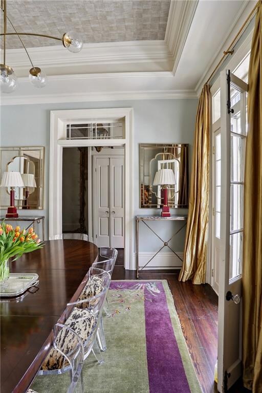 Grand entry opens into a formal parlor with two sets of French doors opening to Governor Nicholls Street