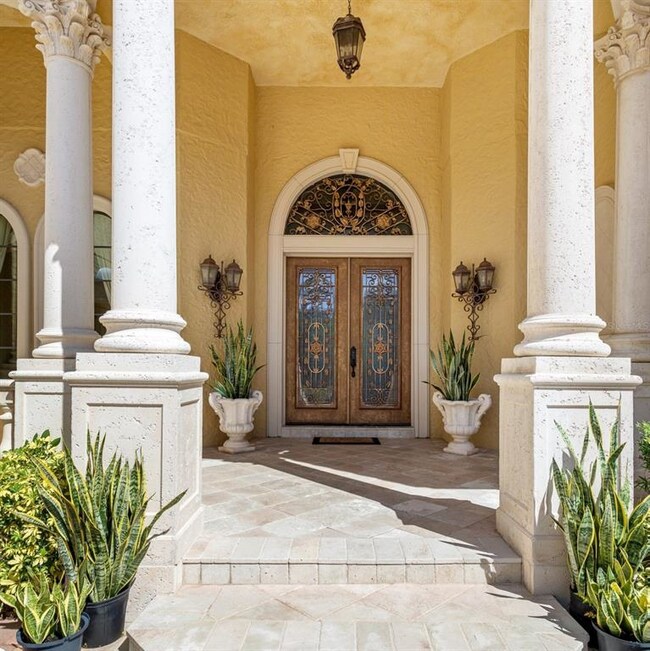 Elegant Entrance with Travertine Pavered Porch
