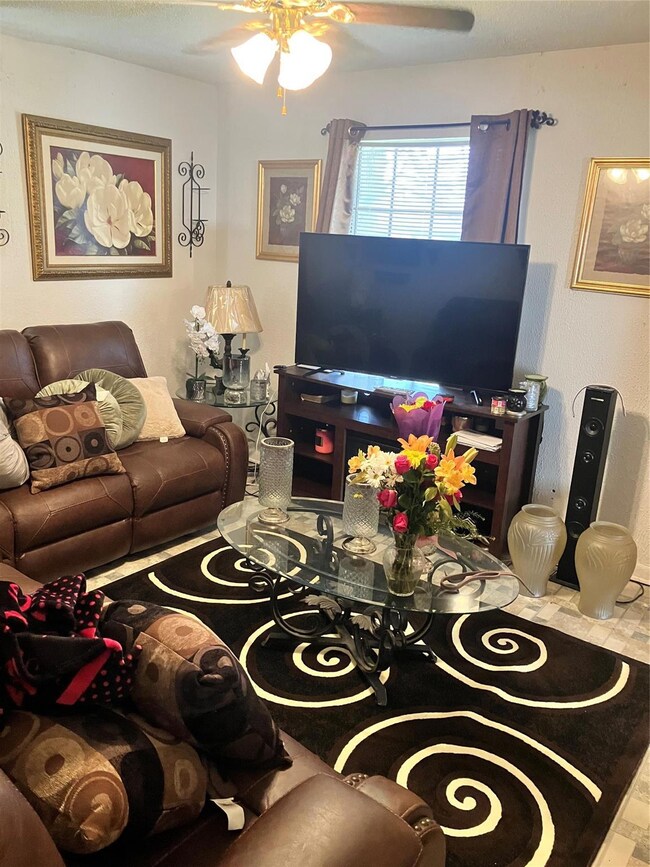 Living room featuring ceiling fan