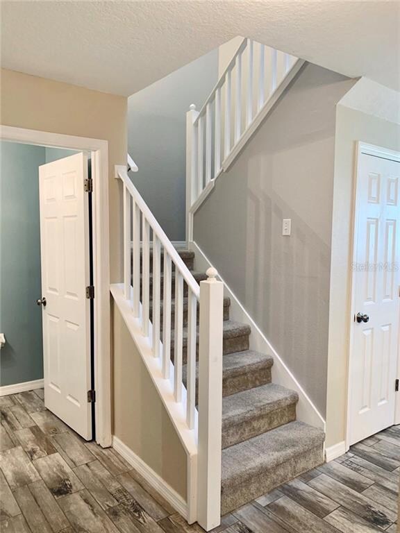 Banister view allows for natural light from skylig