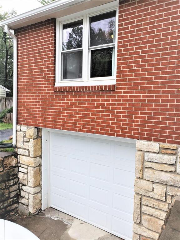 INSULATED GARAGE DOOR AND NEWER WINDOWS