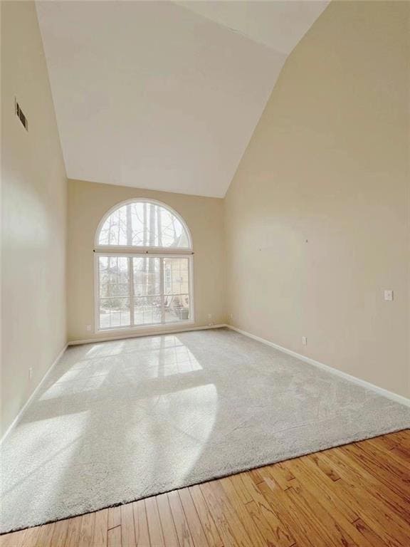 Empty room with baseboards, carpet floors, visible