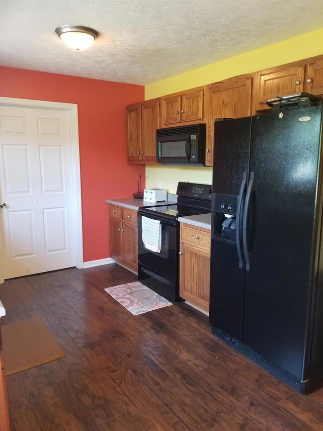 Flooring flows through into the kitchen.