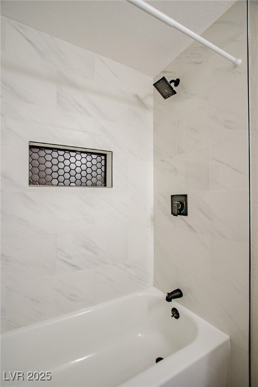 Full bath featuring bathing tub / shower combinati