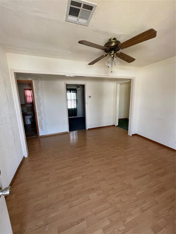 Living room with ceiling fan, hardwood / wood-styl