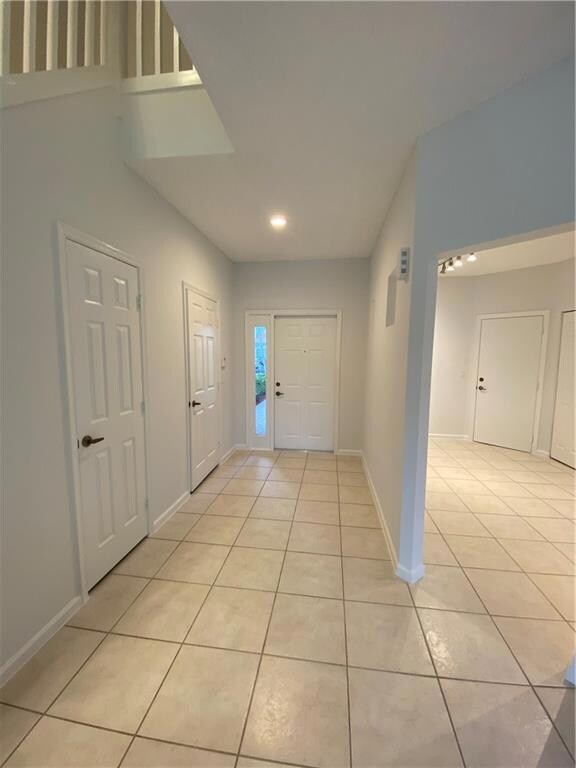 Foyer entrance/powder room/closet space/kitchen