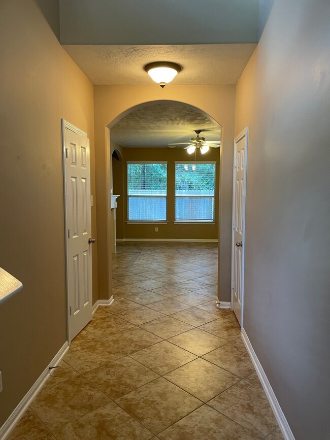 Entry to home with arches and tile flooring on fir