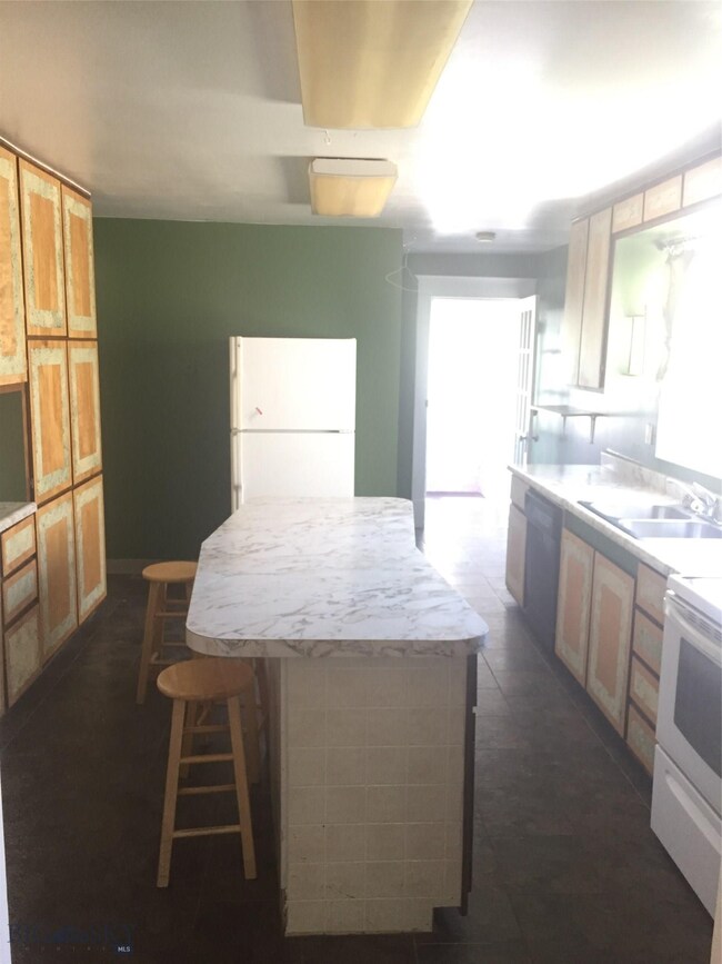Bright kitchen with lots of cabinet space.