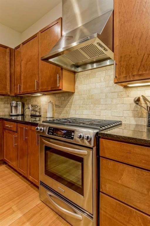 Kitchen with gas stove, wall chimney exhaust hood