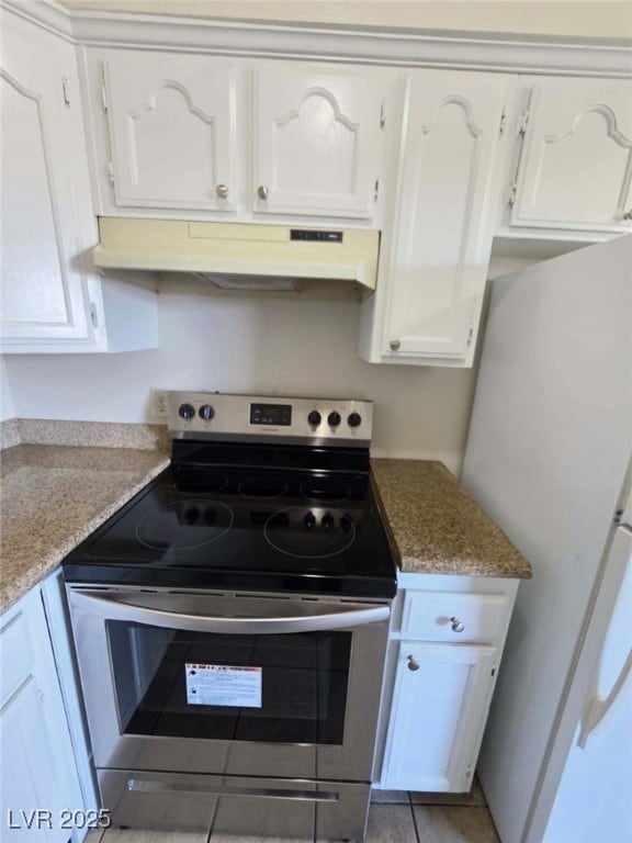 Kitchen featuring stainless steel electric range o