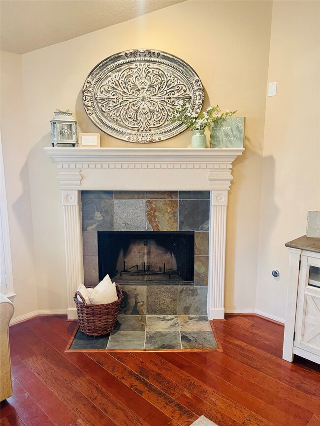 Fireplace in living room for cozy nights.