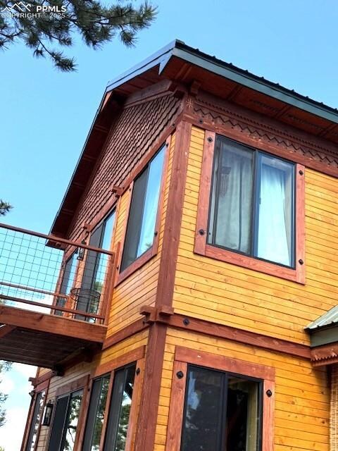 View of property exterior with a balcony