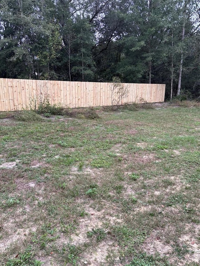Nelly installed privacy fence across back property line!