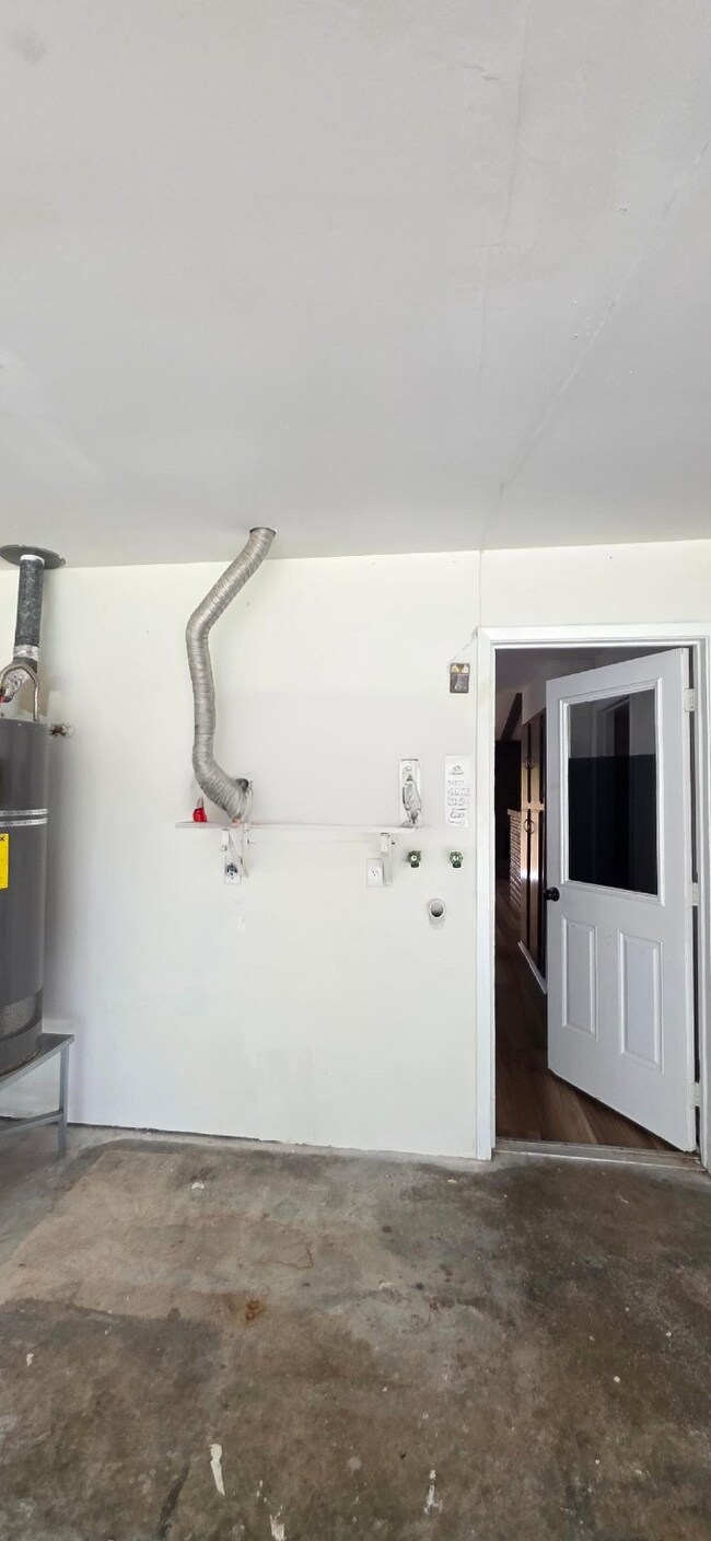 Convenient washer and dryer hookups located in the