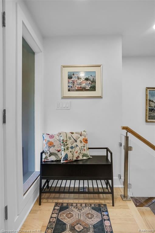 Sitting room featuring light wood finished floors and baseboards
