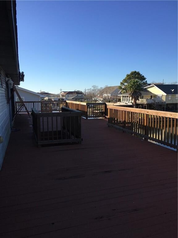 Large deck upstairs, runs width of entire home!