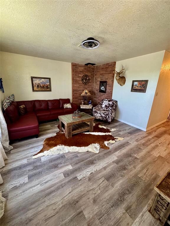 Living room featuring wood finished floors and a t