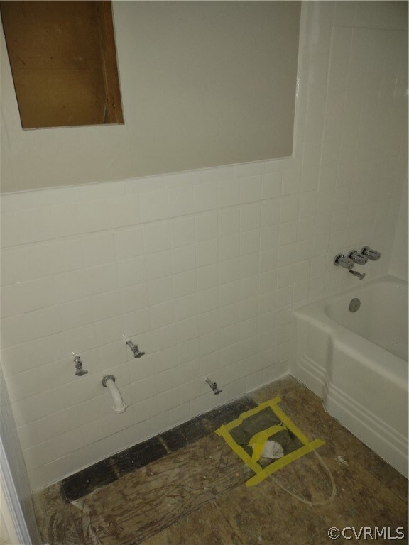 Still needs toilet, mirror, light and vanity