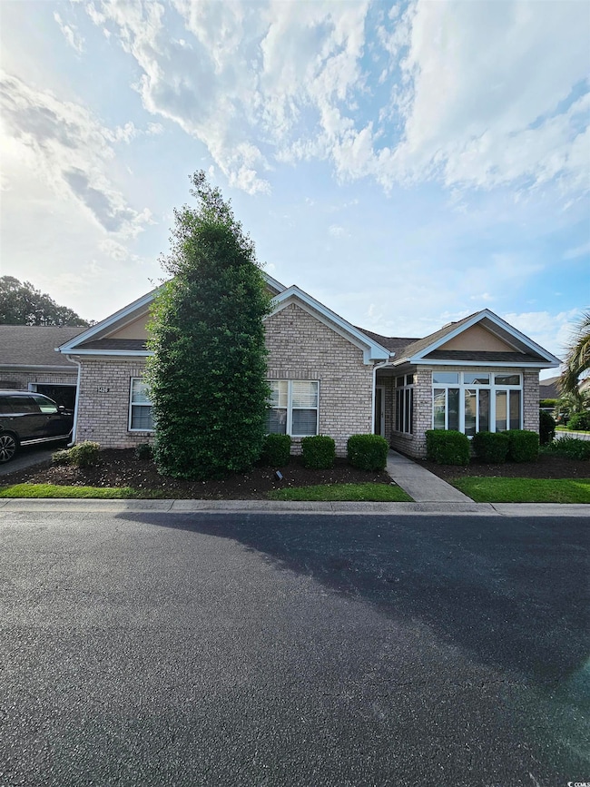 View of front of house with brick siding