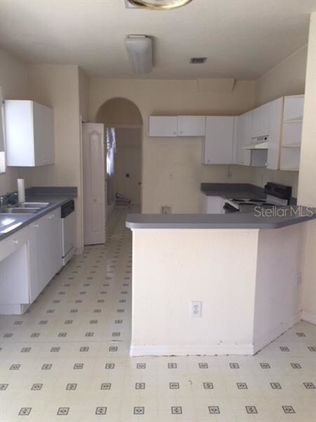 KITCHEN BAR STOOL AREA - PANTRY + LEADS TO LARGE L