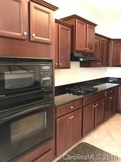 Kitchen with cherry cabinets