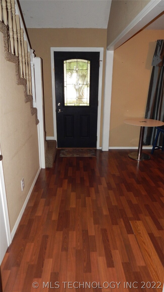 Entry way with great wood floors.