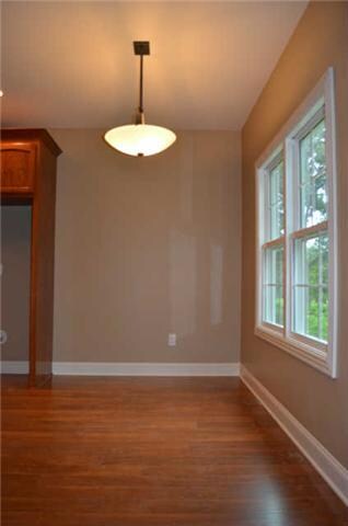 The breakfast area also offers the same pretty laminate HW flooring & nice lighting from the large windows!