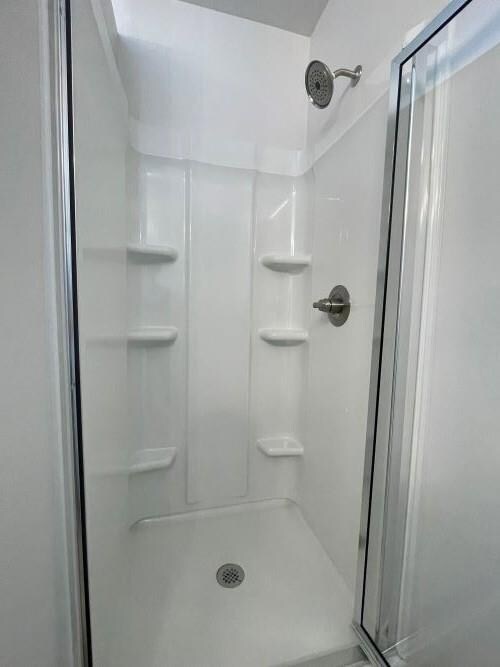 Bathroom featuring walk in shower