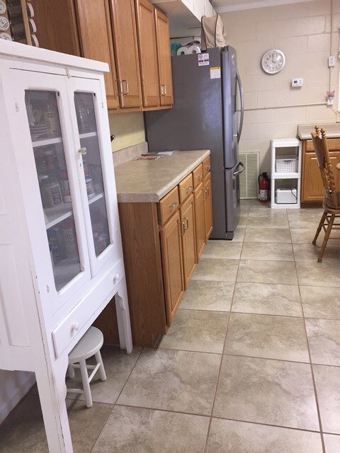 Kitchen with new stainless steel fridge