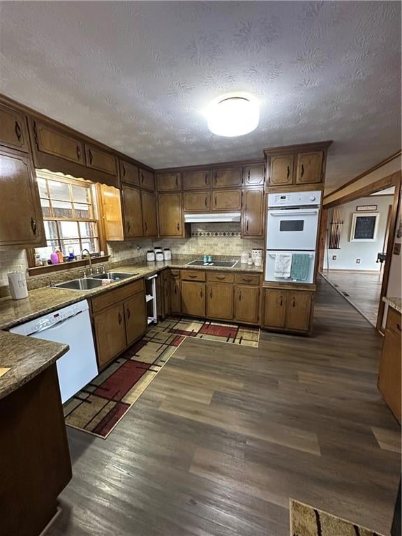 Kitchen featuring dark hardwood / wood-style floor